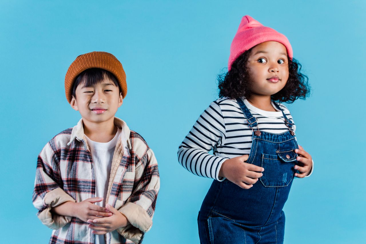 The Art of Drawing Readers In: Your attractive post title goes here Multiethnic kids in casual clothes standing on blue background and making grimace in room
